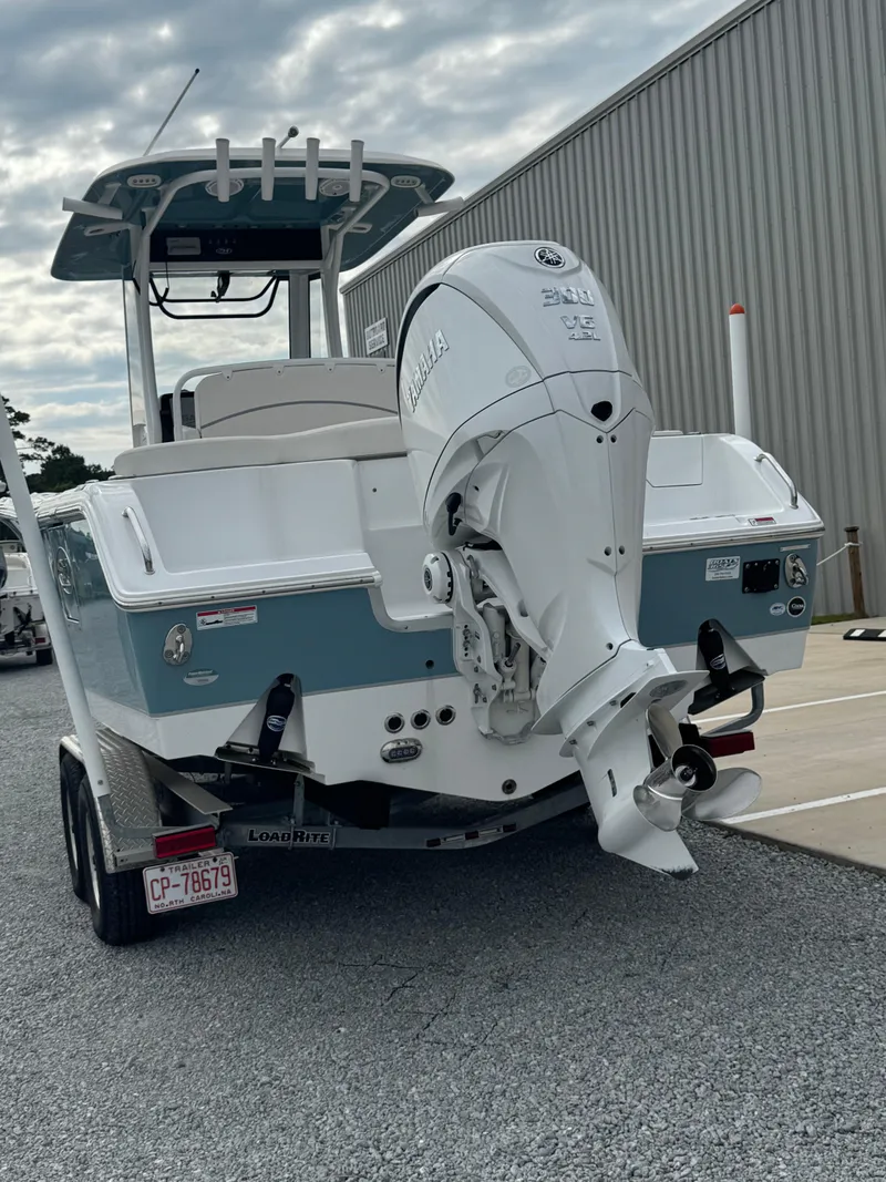 Slide: The Image of 2023 Sea Hunt Ultra 255 SE boat with Yamaha outboard motor on trailer. - 13