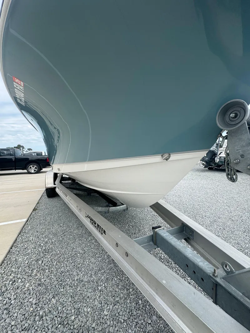 Slide: The Image of 2023 Sea Hunt Ultra 255 SE boat on trailer, side view. - 25