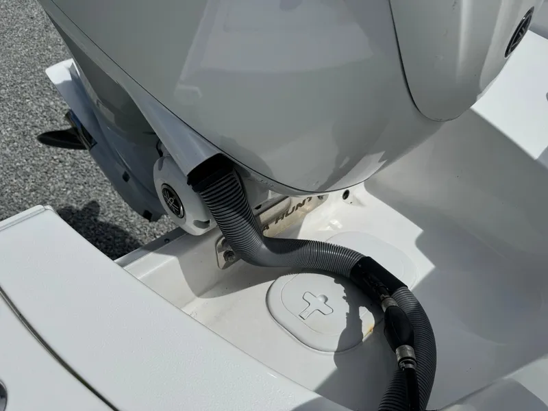 Slide: The Image of 2023 Sea Hunt Ultra 255 SE boat engine detail with cables and connectors. - 7