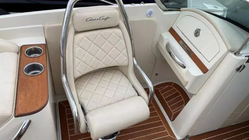 Slide: The Image of 2017 Chris-Craft Launch 28 interior with beige quilted seat and wood accents. - 12
