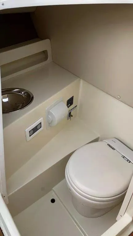 Slide: The Image of 2017 Chris-Craft Launch 28 boat interior with toilet and sink. - 16