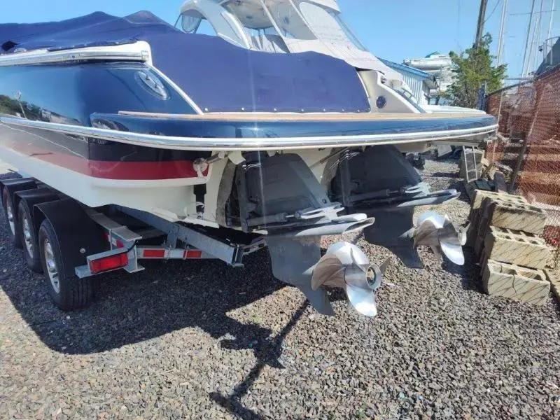 Slide: The Image of 2017 Chris-Craft Launch 28 boat on trailer, rear view with dual propellers. - 25