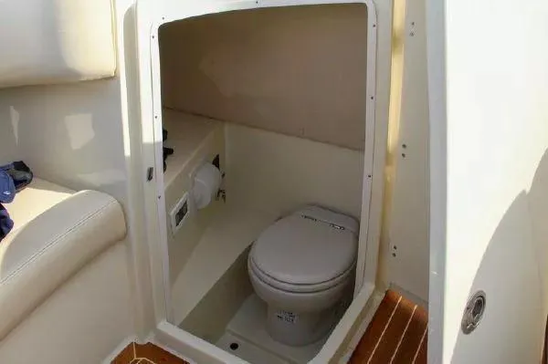 Slide: The Image of 2017 Chris-Craft Launch 28 boat interior with compact marine toilet. - 9