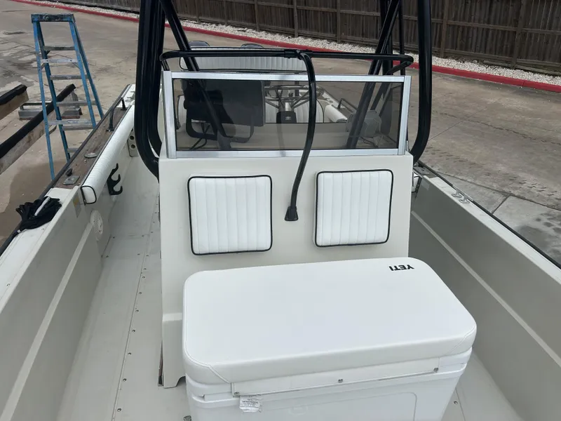 Slide: The Image of 1983 Boston Whaler 25 Outrage boat interior with seating and Yeti cooler. - 13