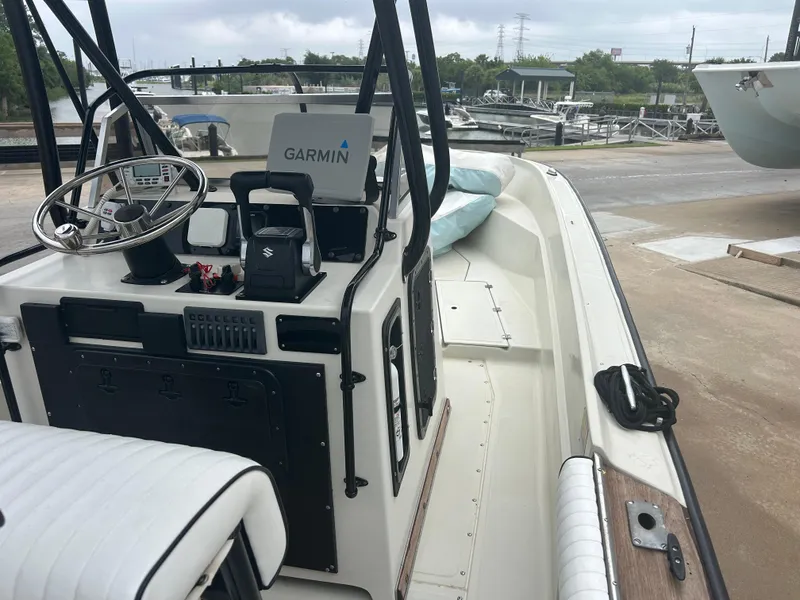 Slide: The Image of 1983 Boston Whaler 25 Outrage boat with Garmin navigation, docked at marina. - 14