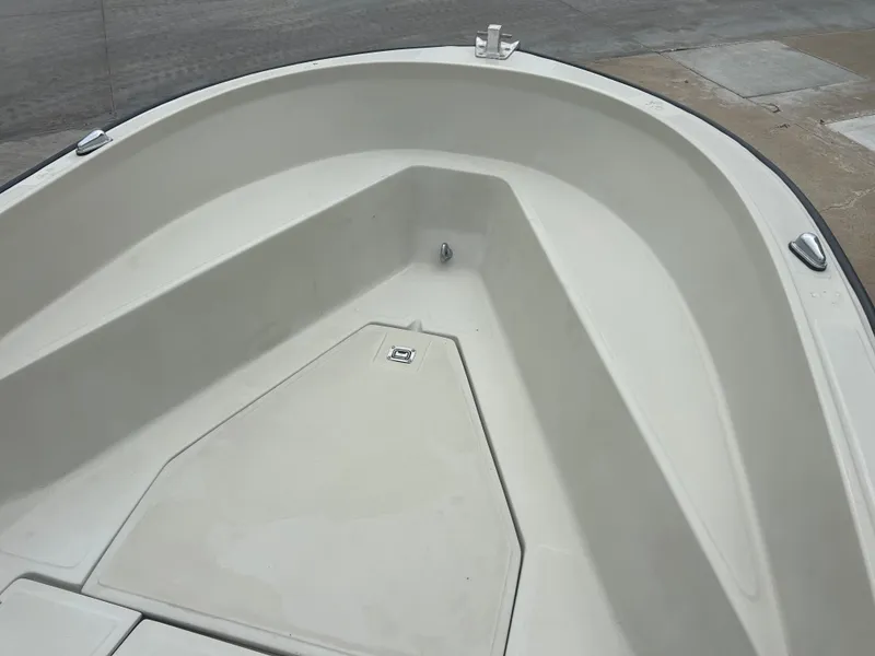 Slide: The Image of 1983 Boston Whaler 25 Outrage boat bow, showcasing clean, spacious deck design. - 17