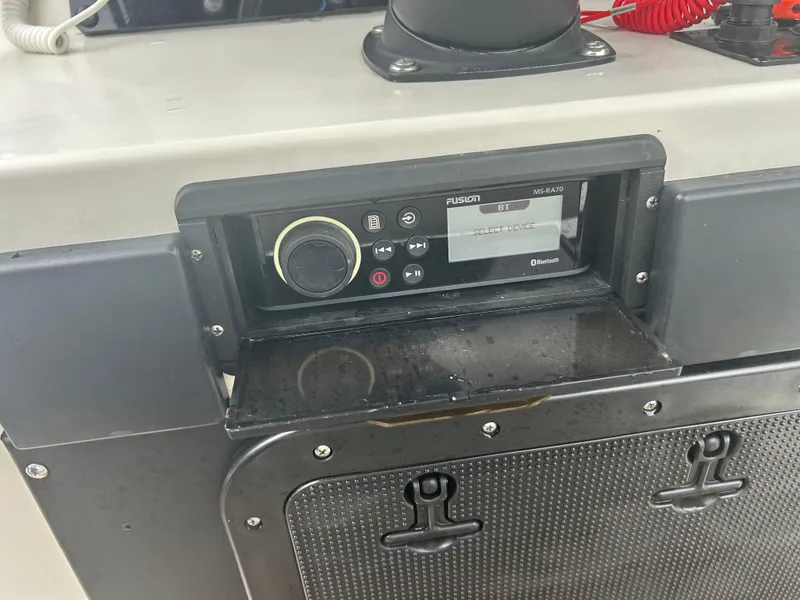 Slide: The Image of Fusion marine stereo system on a 1983 Boston Whaler 25 Outrage boat console. - 24