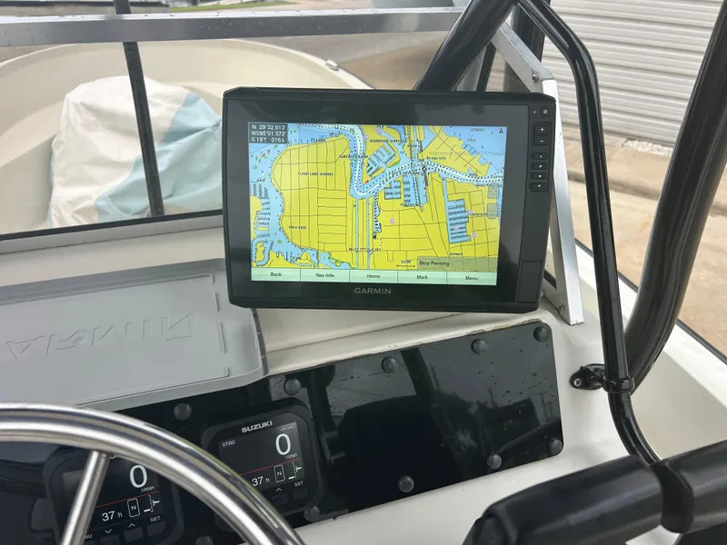 Slide: The Image of 1983 Boston Whaler 25 Outrage dashboard with Garmin navigation display showing nautical map. - 28