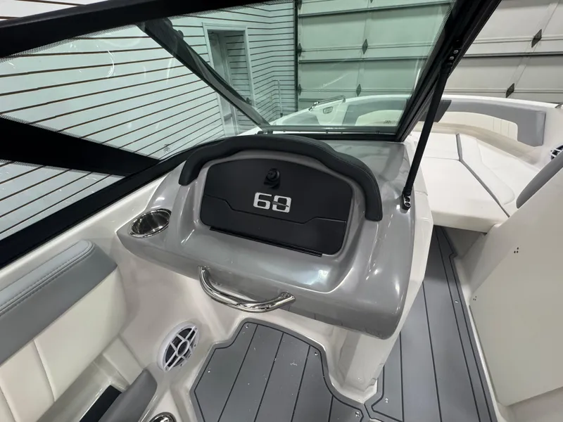 Slide: The Image of 2025 Chaparral 21 SSi boat interior with sleek dashboard and seating. - 12