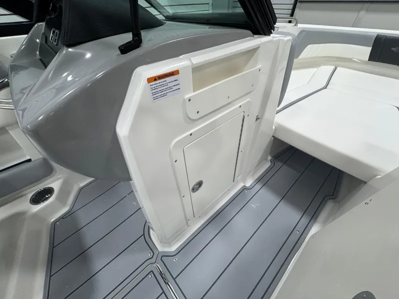 Slide: The Image of 2025 Chaparral 21 SSi boat interior with sleek gray and white design. - 13