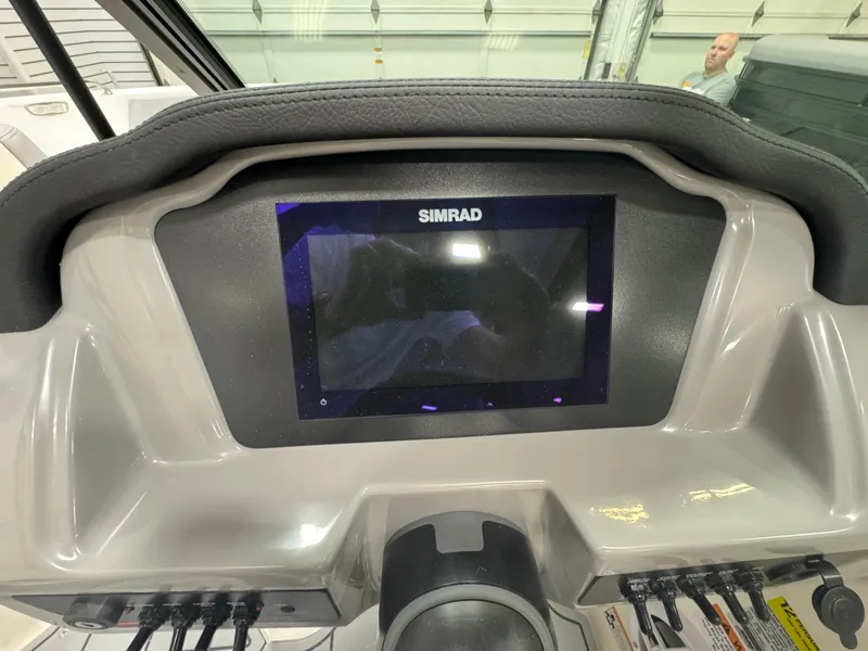 Slide: The Image of Dashboard of 2025 Chaparral 21 SSi boat featuring a Simrad display. - 15