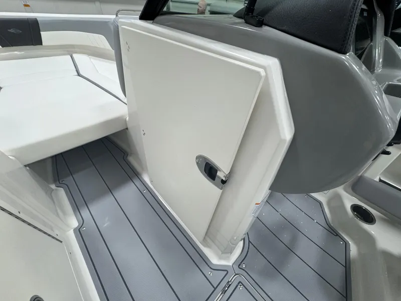 Slide: The Image of 2025 Chaparral 21 SSi boat interior with sleek design and storage compartment. - 17