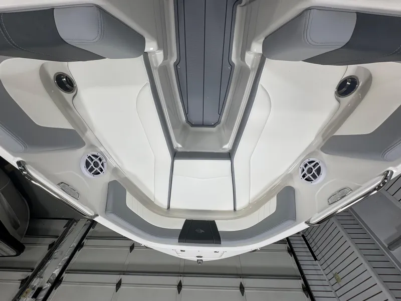 Slide: The Image of 2025 Chaparral 21 SSi boat interior, featuring sleek seating and modern design elements. - 19
