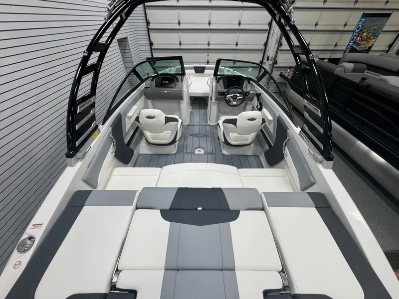 Slide: The Image of 2025 Chaparral 21 SSi boat interior with sleek seating and modern dashboard design. - 5