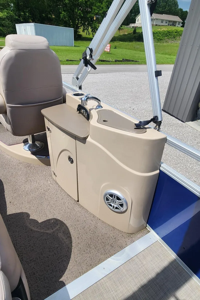 Slide: The Image of 2014 Sun Tracker Regency Edition 254 XP3 boat interior with sink and speaker. - 11