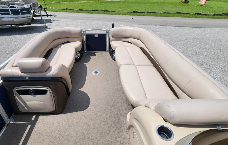Slide: The Image of 2014 Sun Tracker Regency Edition 254 XP3 pontoon boat with beige seating and spacious deck. - 5
