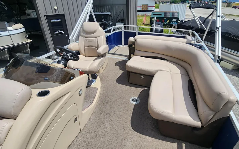 Slide: The Image of 2014 Sun Tracker Regency Edition 254 XP3 pontoon boat interior with beige seating and helm. - 6