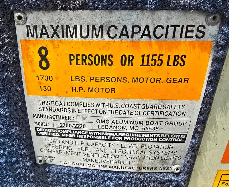 Slide: The Image of Maximum capacity label for Lowe LS 2220 boat, 8 persons or 1155 lbs, 1997 model. - 11
