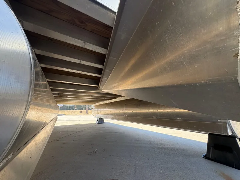 Slide: The Image of Underneath view of a 2025 Custom Maui 160 Cruise boat, showcasing aluminum pontoons. - 4