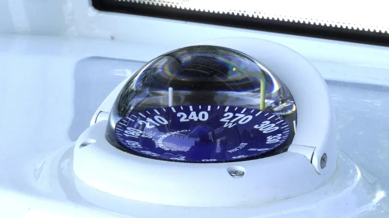 Slide: The Image of Compass on 2025 Tidewater 282 CC Adventure boat dashboard. - 22