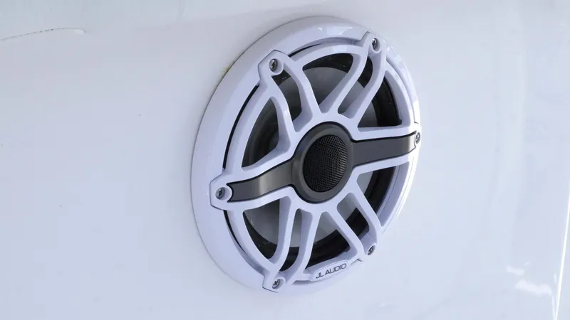 Slide: The Image of Speaker on 2025 Tidewater 282 CC Adventure boat, featuring a sleek white grille design. - 24