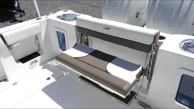 Slide: The Image of 2025 Tidewater 282 CC Adventure boat seating area with sleek, modern design and comfortable upholstery. - 25