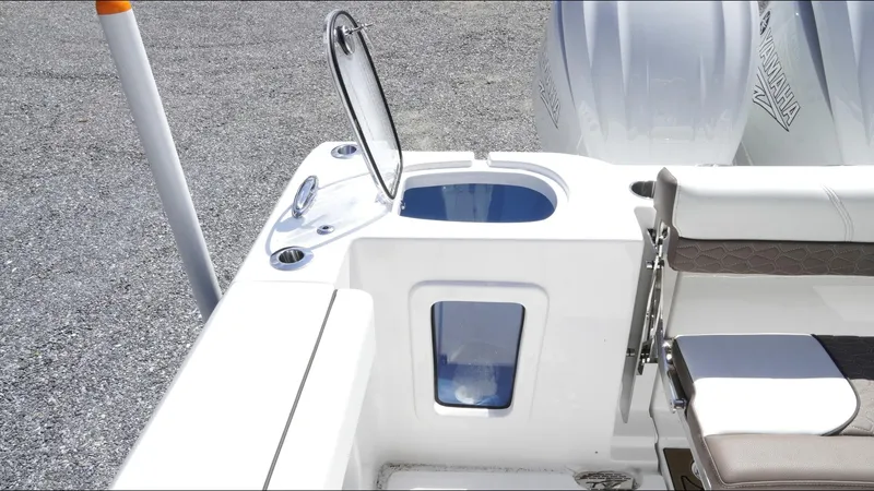 Slide: The Image of 2025 Tidewater 282 CC Adventure boat interior with open hatch and seating area. - 27