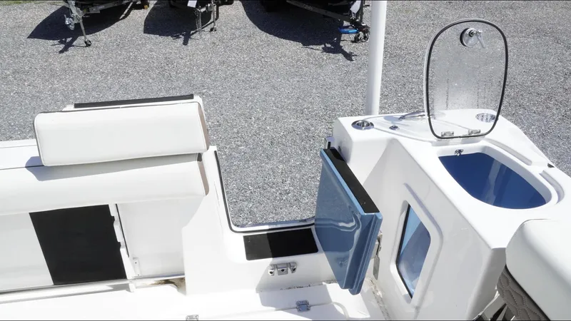 Slide: The Image of 2025 Tidewater 282 CC Adventure boat interior with seating and storage compartments. - 29