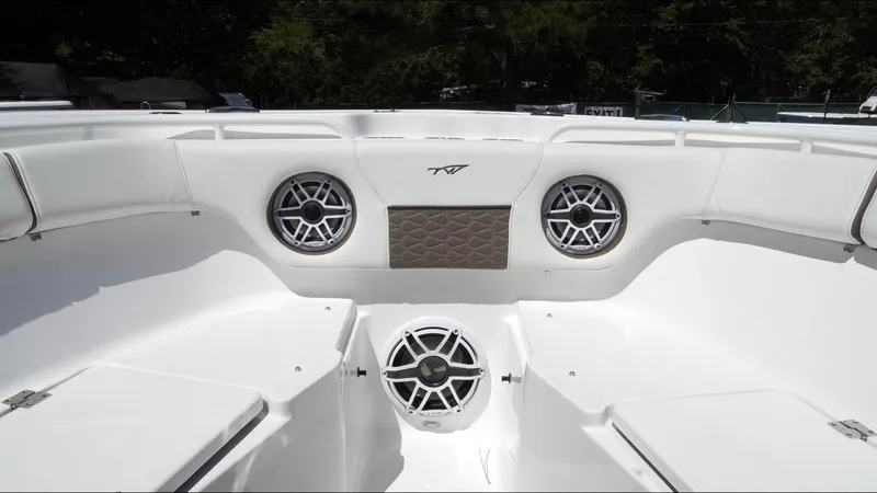 Slide: The Image of 2025 Tidewater 282 CC Adventure boat interior with speakers and seating. - 33