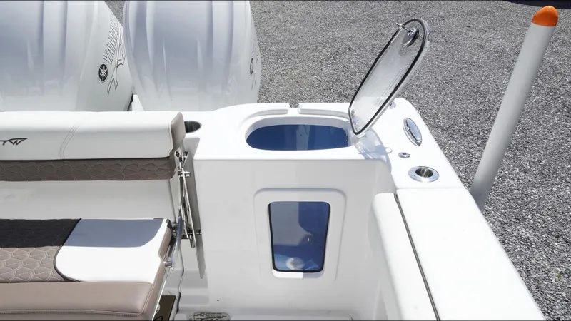 Slide: The Image of 2025 Tidewater 282 CC Adventure boat interior with open hatch and seating. - 35