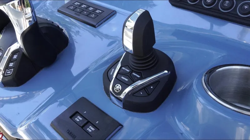 Slide: The Image of Control panel of 2025 Tidewater 282 CC Adventure boat with joystick and buttons. - 37
