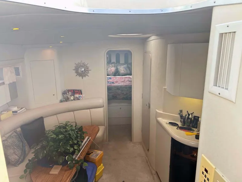 Slide: The Image of Interior of 1997 Cruisers Yachts 4270 Esprit, featuring cozy seating and modern amenities. - 12