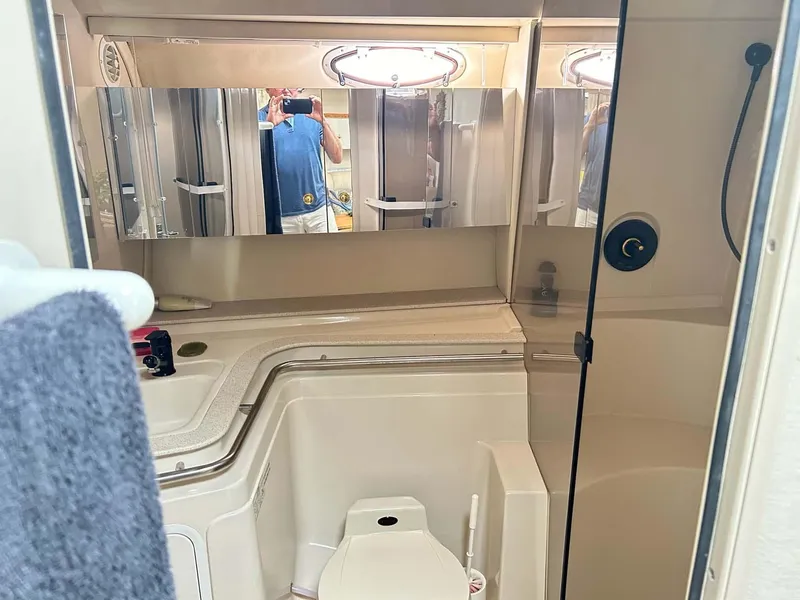 Slide: The Image of Bathroom interior of 1997 Cruisers Yachts 4270 Esprit with mirrored cabinets and shower. - 15