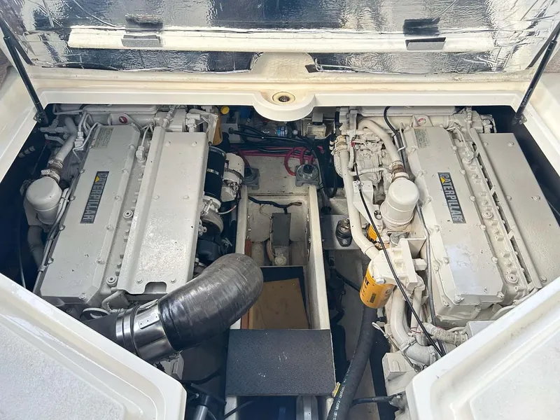 Slide: The Image of Engine compartment of a 1997 Cruisers Yachts 4270 Esprit, featuring dual engines. - 16