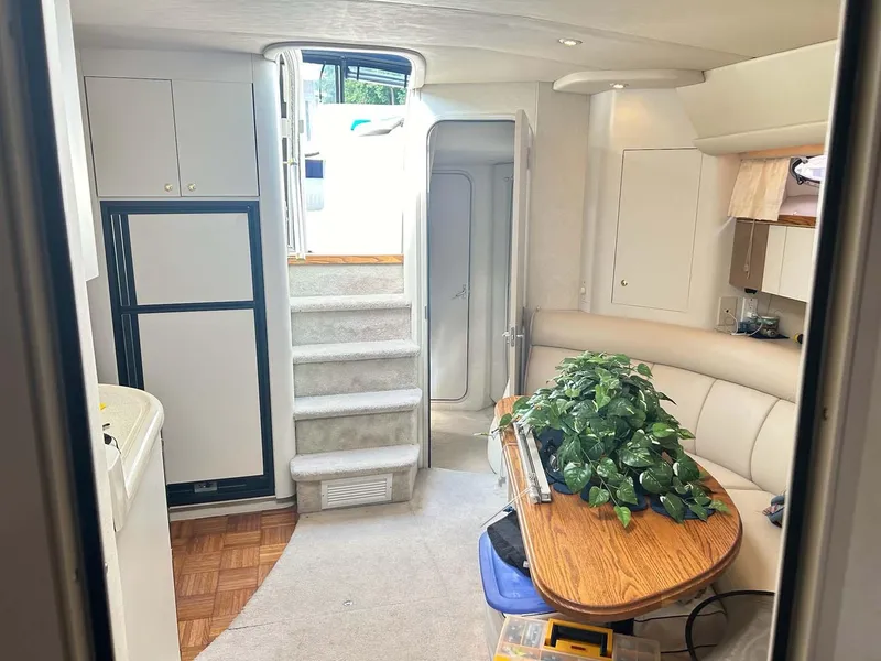 Slide: The Image of Interior of 1997 Cruisers Yachts 4270 Esprit with cozy seating and dining area. - 9