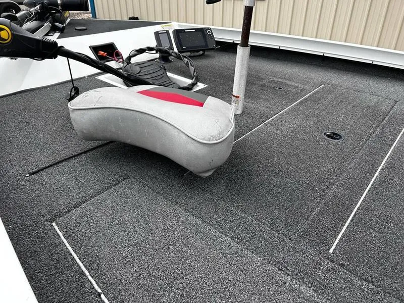 Slide: The Image of 2017 Lowe Stinger 175 boat deck with seat and fishing equipment. - 13