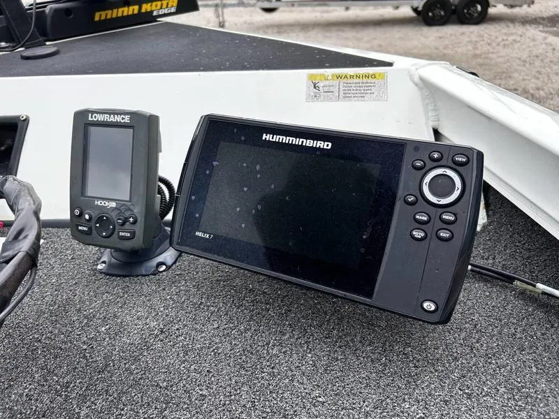 Slide: The Image of Fish finders on a 2017 Lowe Stinger 175 boat dashboard. - 14