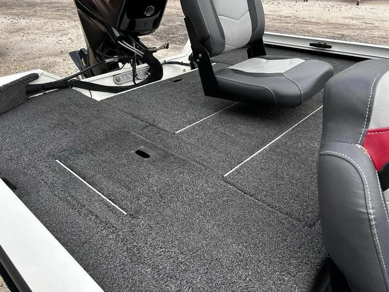 Slide: The Image of 2017 Lowe Stinger 175 boat interior with gray seating and carpeted deck. - 7