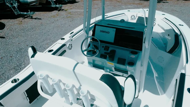 Slide: The Image of 2025 Tidewater 210 LXF boat interior with steering wheel and control panel. - 10