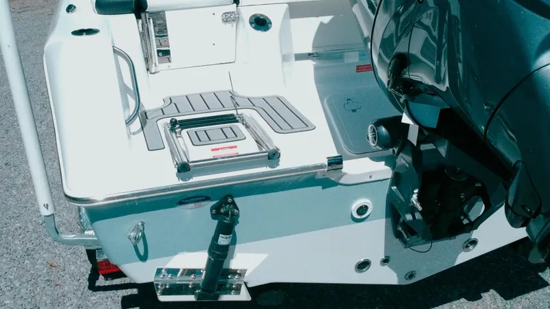 Slide: The Image of 2025 Tidewater 210 LXF boat stern with motor and swim platform. - 11