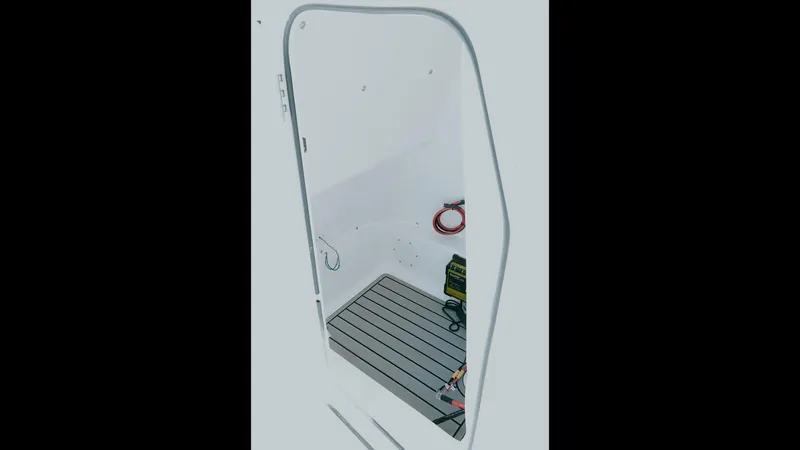 Slide: The Image of Interior view of 2025 Tidewater 210 LXF boat, featuring sleek design and modern flooring. - 12
