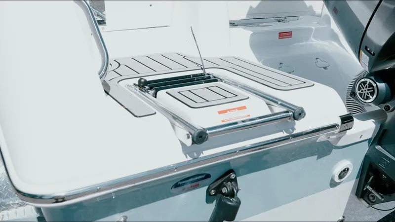 Slide: The Image of 2025 Tidewater 210 LXF boat with a sleek, modern design and integrated swim ladder. - 18