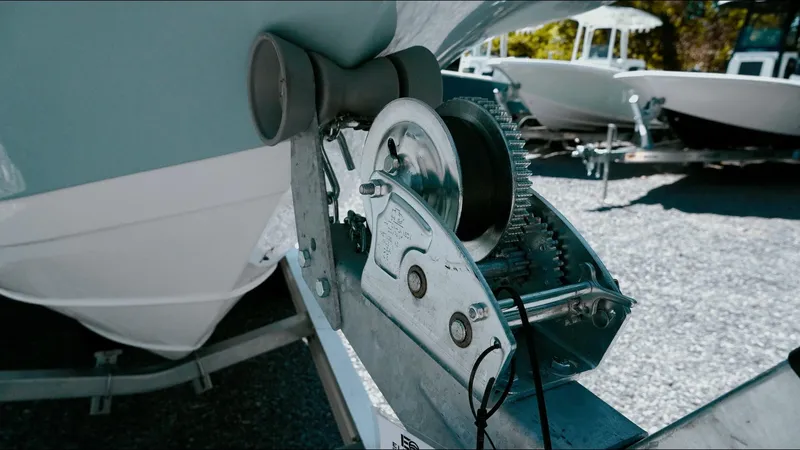 Slide: The Image of 2025 Tidewater 210 LXF boat on trailer with winch mechanism in focus. - 20