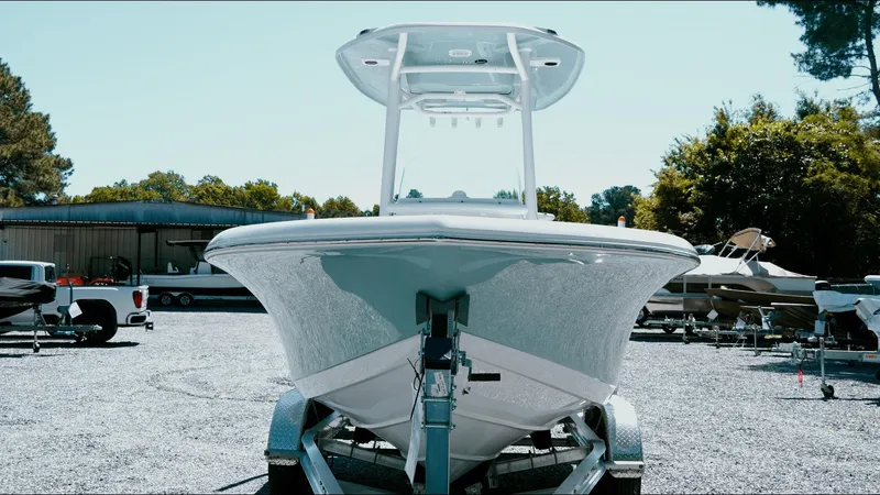 Slide: The Image of 2025 Tidewater 210 LXF boat on trailer in outdoor lot. - 22