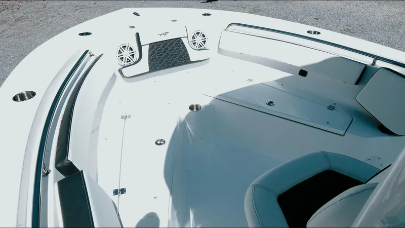 Slide: The Image of 2025 Tidewater 210 LXF boat interior with seating and speakers, showcasing modern design. - 24