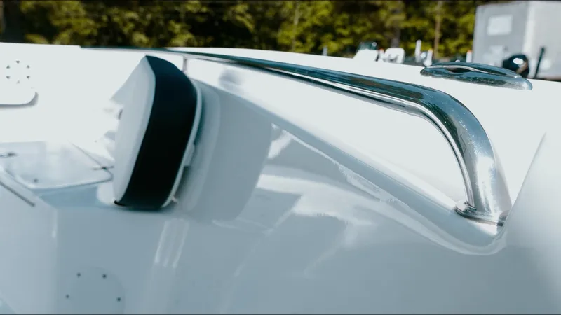 Slide: The Image of 2025 Tidewater 210 LXF boat detail with sleek chrome railing and white finish. - 32