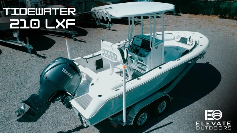 Slide: The Image of 2025 Tidewater 210 LXF boat with Yamaha engine on trailer, displayed outdoors. - 37