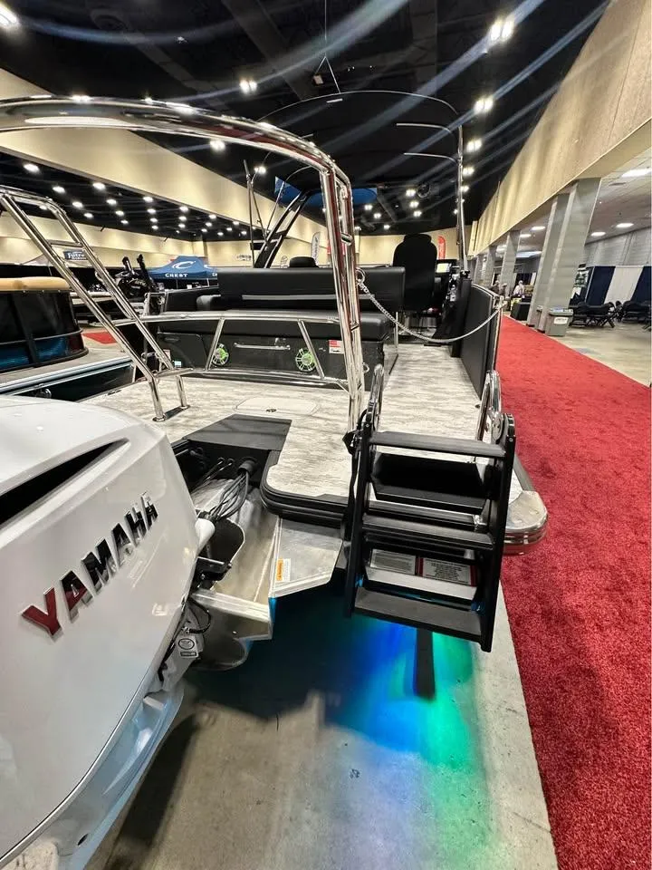 Slide: The Image of 2025 Crest Caribbean RS 230 boat with Yamaha engine at indoor exhibition. - 10