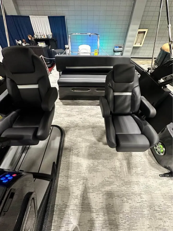 Slide: The Image of 2025 Crest Carribean RS 230 interior with modern black seating and sleek design. - 12