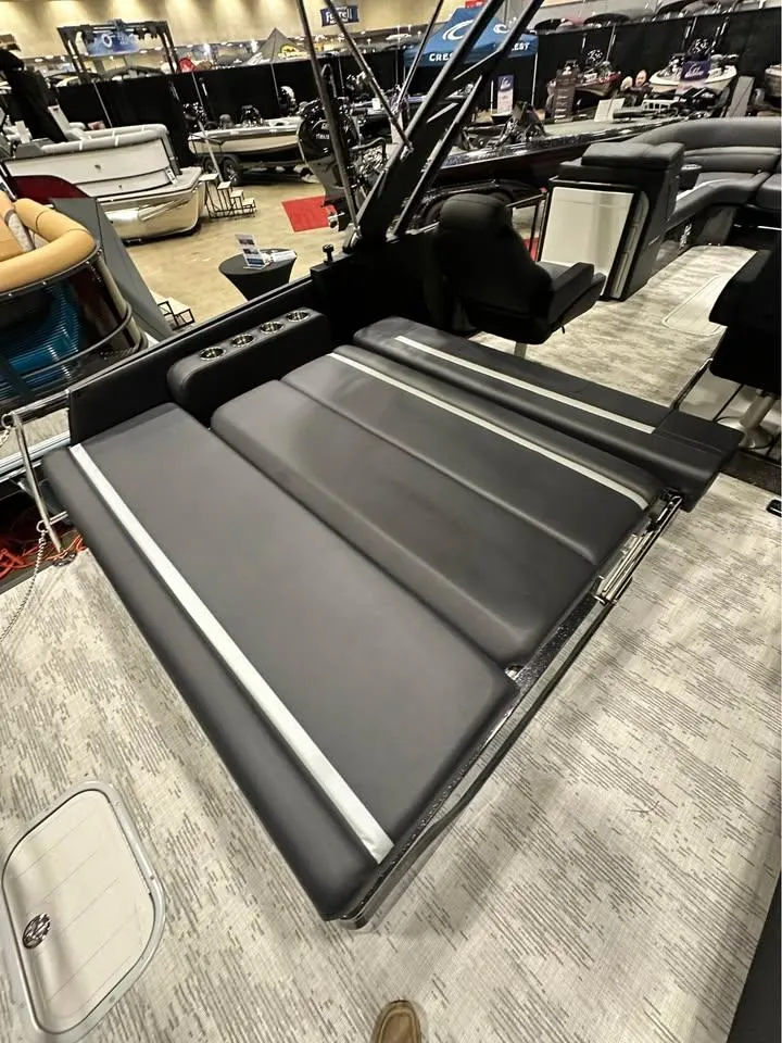 Slide: The Image of 2025 Crest Carribean RS 230 boat interior with sleek black seating and modern design. - 4